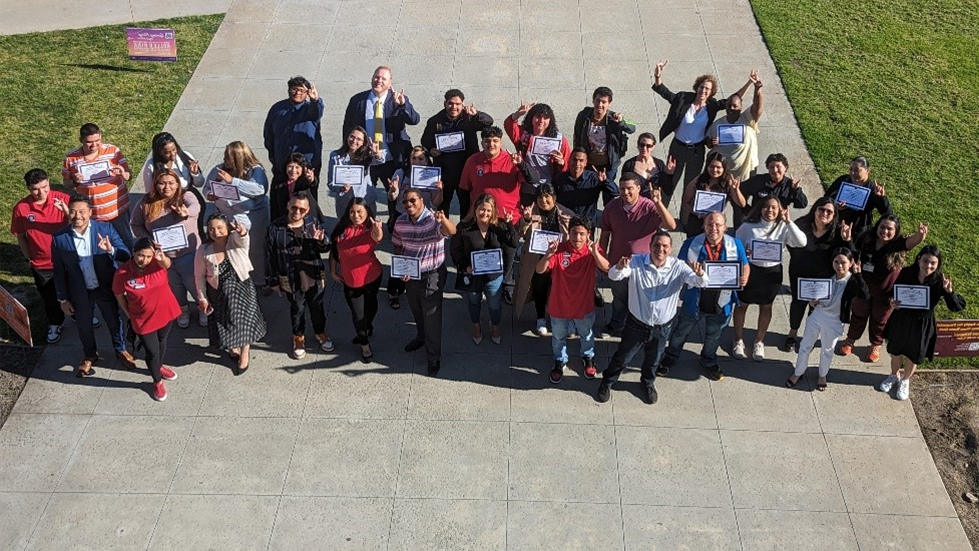 group of students with certificates